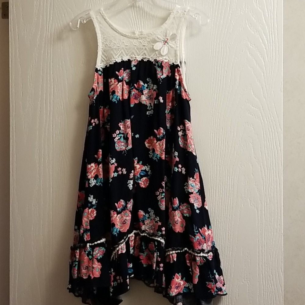 Girls navy and lace dress with flower detail.